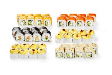 Appetizing set of various rolls for Japanese style family dinner with salmon, baked tuna, cheese dressed with unagi sauce on white background. Popular authentic cuisine