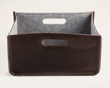 Stylish handmade brown leather box-organizer, lined with felt inside, with handles for storing things at home and in office