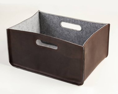 Handcrafted box in brown faux leather with felt lining and handles for comfortable sorting and storage of stationery or household tools. Stylish accessories to organize home and office space