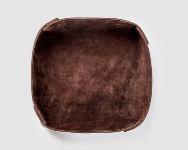 Functional valet tray of natural tanned brown leather perfect for storing daily essentials in modern space. Handmade accessories for interior design