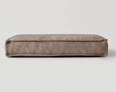 Beyaz bir yüzey üzerinde dinlenen büyük bir dikdörtgen döşeme yastığının stüdyo görüntüsü, basit ama rahat tasarımını sergiliyor.