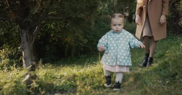 Mom Walks Her Little Daughter Park Girl Runs Ahead Her — Stock Video