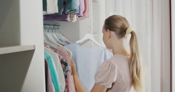 Teenager Chooses Dress Dressing Room — ストック動画