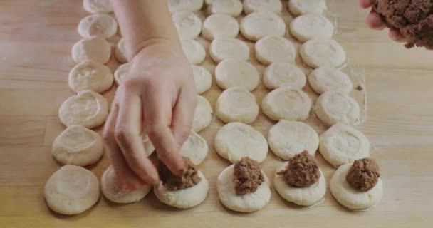 Baker Puts Minced Meat Filling Dough Pieces Cooking Dumplings — Stock Video