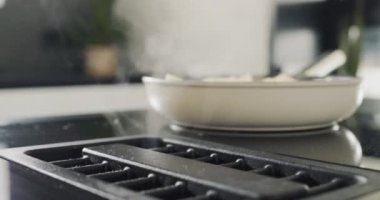 Potatoes are fried on a modern induction cooker. Built-in extractor works.