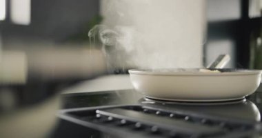 Potatoes are fried on a modern induction cooker. Built-in extractor works.