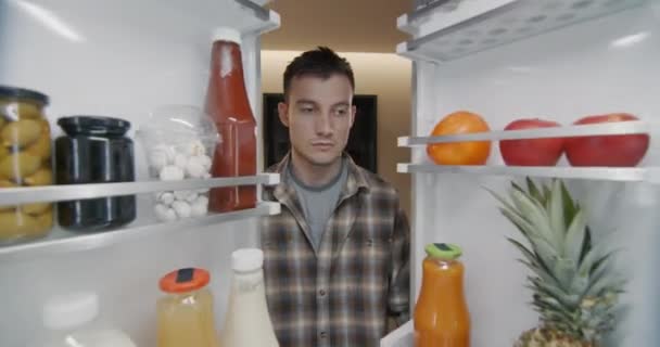 Young Man Takes Container Breakfast Refrigerator View Refrigerator — Stock Video