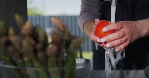 Woman Washes Tomatoes Foreground Bowl Asparagus — Stock Video