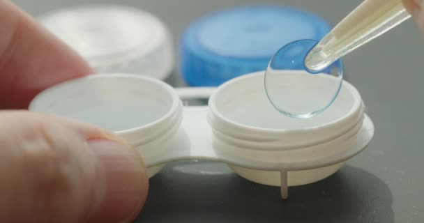 Close Contact Lens Container Tweezers Hand Retrieving Lens — Stock Video