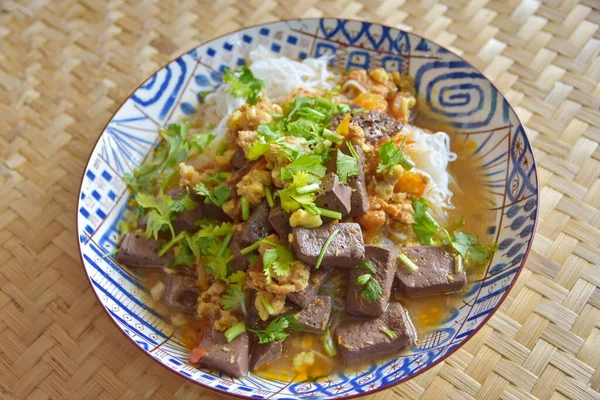 Rice noodles with spicy pork sauce. Local food of Thai in the north of Thailand.