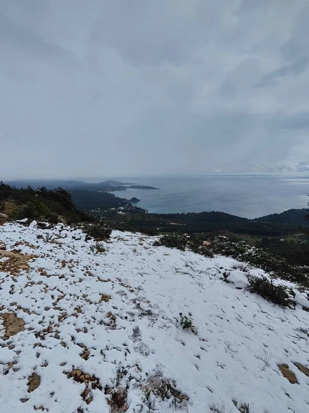 Snow in the mountains of Ibiza, a short distance from the sea. Vertical footage