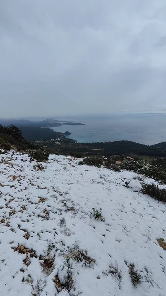Snow in the mountains of Ibiza, a short distance from the sea. Vertical footage