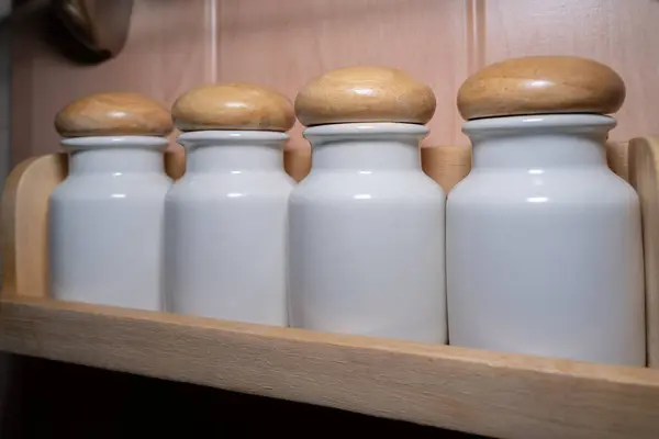 Salt and spice shakers on the wall