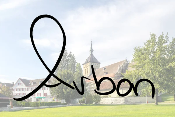 Stock image Arbon handwritten with a photo of the place in the background