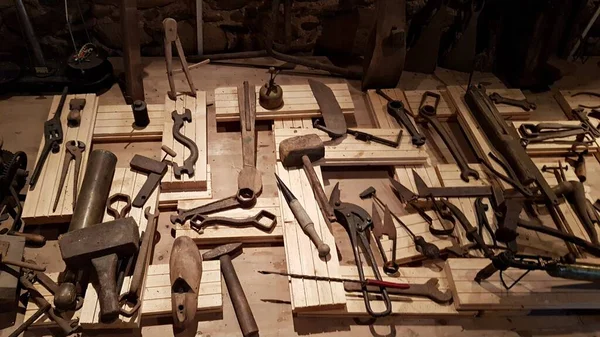 Lot of various old carpentry tools that grandfathers worked in last century.