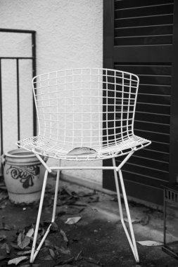 black and white photo of a cafe with a chair