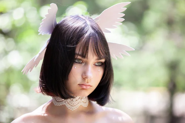 beautiful young woman with angel wings