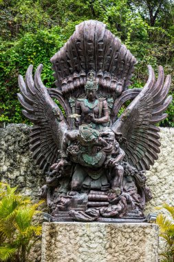 Small Garuda Vishnu Kencana Statue - Bali. Kuta. Indonesia clipart