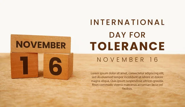 The words International Day for Tolerance are engraved on a wooden block with the date 16. Happy Tolerance Day. white background, copy space.