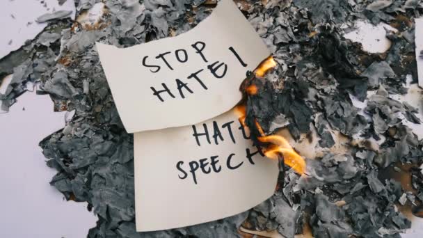 Burning Paper English Words Stop Asian Hate Background Ashes Racism — стоковое видео