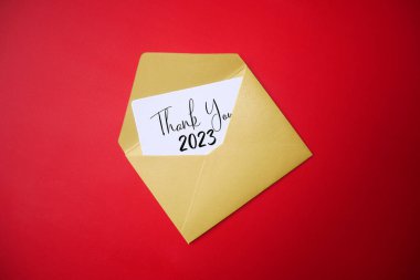 A piece of paper in an envelope with the words BYE BYE 2023. Goodbye 2023, welcome 2024. clipart