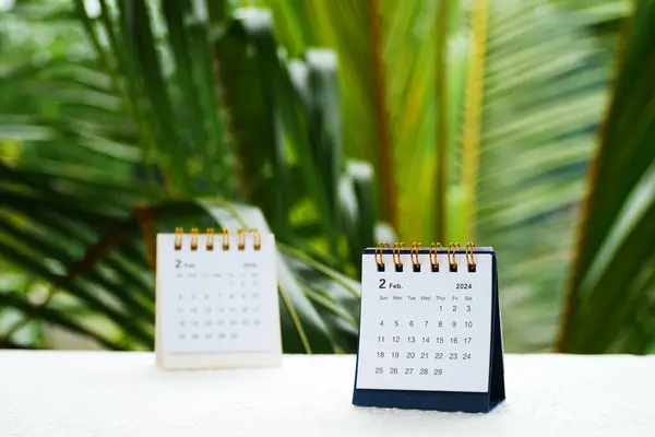 stock image February 2024. Desk calendar for February 2024 on the table.