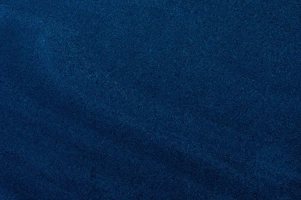 İnce eğimli ince taneli koyu mavi kum dokusu, arka plan ve dizayn örtüleri için ideal..