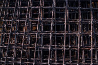 Steel mesh for reinforcement concrete in construction site, closeup of photo