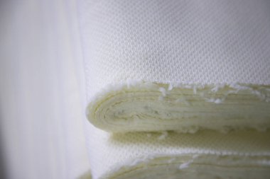 Close-up focus folded stacked sherpa fabric backdrop pattern textured  can be used as a background wallpaper