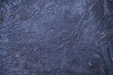 Old metal surface covered black ash abstract background texture