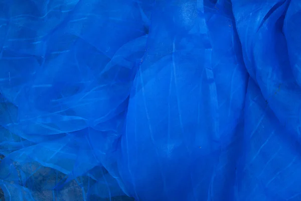 半透明的蓝网织物可用作背景墙纸 — 图库照片