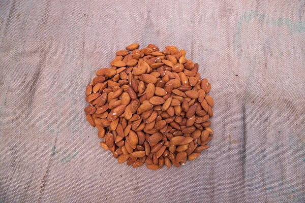 Some Almonds Brown Jute Fiber Fabric — Stock Photo, Image
