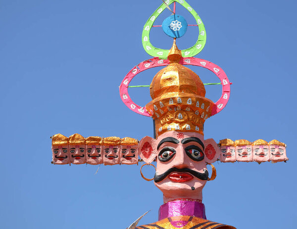 Close-up of Rawan's fierce face with multiple heads, showcasing intense expressions and intricate detailing