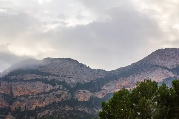 stock image Mountain landscape with a beautiful clouds. Rincon Bello, Agost, Spain. High quality photo