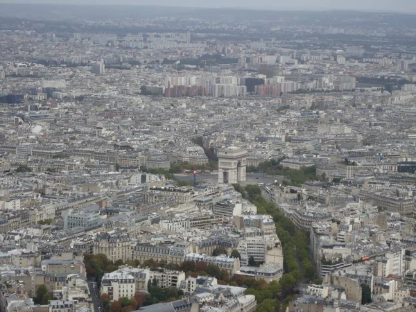 stock image Views of Paris from above with its urban life and its impressive monuments, including the Eiffel Tower