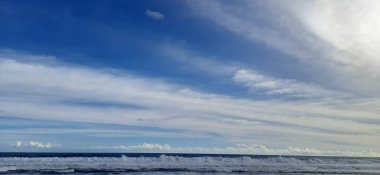 Beautiful tropical beach with abstract texture background of blue sky and white clouds