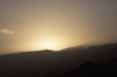 Hazardous calima caused by Sahara sand in the west coast of Tenerife, including Tabaiba and Candelaria, after Storm Dorothea. The image showcases reduced visibility, dusty skies, and atmospheric haze clipart