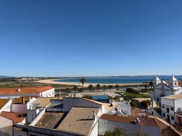 Old town in the center of Lagos, Algarve region, Portugal. Showing beach with blue skies