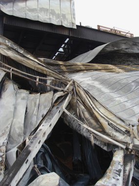 The roof of the warehouse building that was deformed and collapsed due to the fire