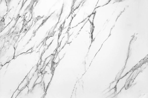 Texture of white marble with black and gray streaks, tiles imitate natural stone.