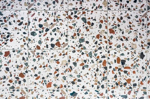 stock image The texture of ceramic terrazzo tiles, many different granular inclusions from multi-colored pebbles.