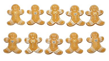 Set of gingerbread men with icing decoration, holiday cookies isolated on white background. clipart