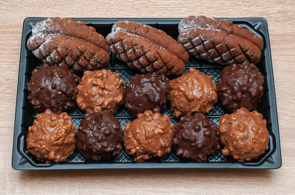 Christmas-themed chocolate cookies shaped like pine cones, paired with crunchy chocolate treats.