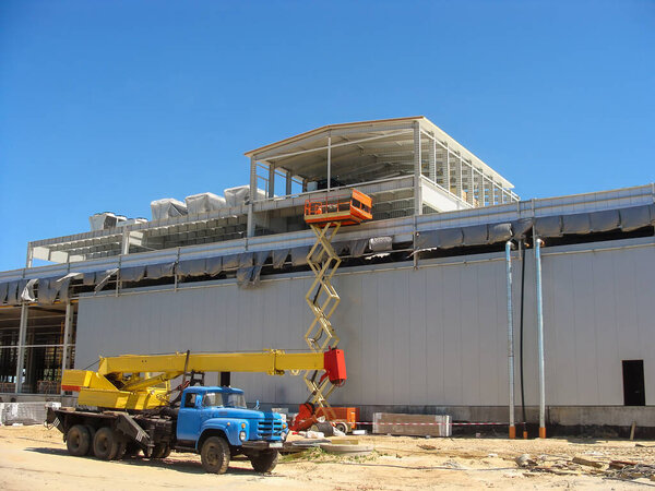 Cold storage warehouse construction with metal frame and insulated panels.