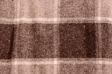 Soft plaid fabric texture in mocha-mousse shades, detailed woven fibers. clipart