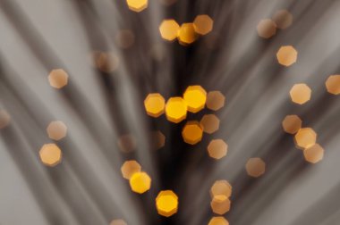 Turuncu sekizgen ışıklarla soyut bir arka plan, şenlikli ve rüya gibi bir atmosfer yaratıyor, parti veya tatil tasarımları için harika..