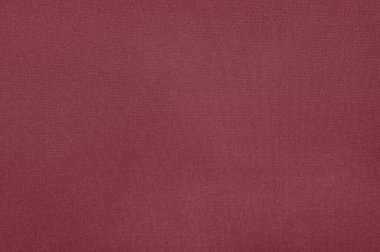 Bu görüntü, tüm çerçeveyi kaplayan desenli, koyu kestane rengi bir kumaşın yakın çekim görüntüsünü sunar. Doku pürüzsüz, güzel bir zemin oluşturuyor..