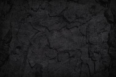 Siyah beton ya da ağaç kabuğu dokusu. Sert çimento desenli koyu bir duvar kağıdı. Boş grunge duvar konsepti veya zemin zemin zemin. Soyut yüzey modeli. Üst görünüm, kapat, boşluğu kopyala