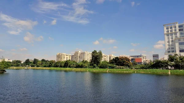 stock image Bangalore,Karnataka,India-September 18 2022: Beautiful view of garden city aka Bangalore with Lakes, infrastructure with green cover awnd clear sky