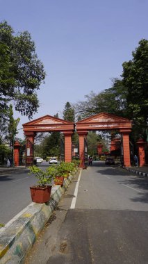 Bangalore,Karnataka,India-January 16 2024: Front entrance and view of the Cubbon park. Located in the heart of Bengaluru or central Bangalore. clipart